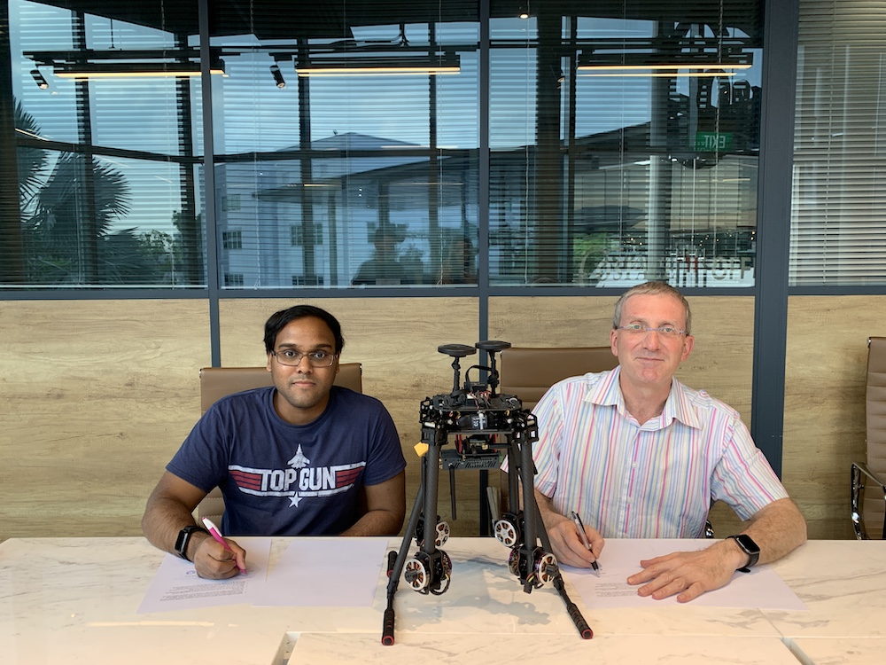 Figure 1 - Chandruth Jayasiriwardena, Nimbus UAV's Co-Founder, and Erel Rosenberg, DFRC's CEO, signing the MoU and presenting the integrated version of the Nimbus 690 UAV with Anthea 202 sensor.
